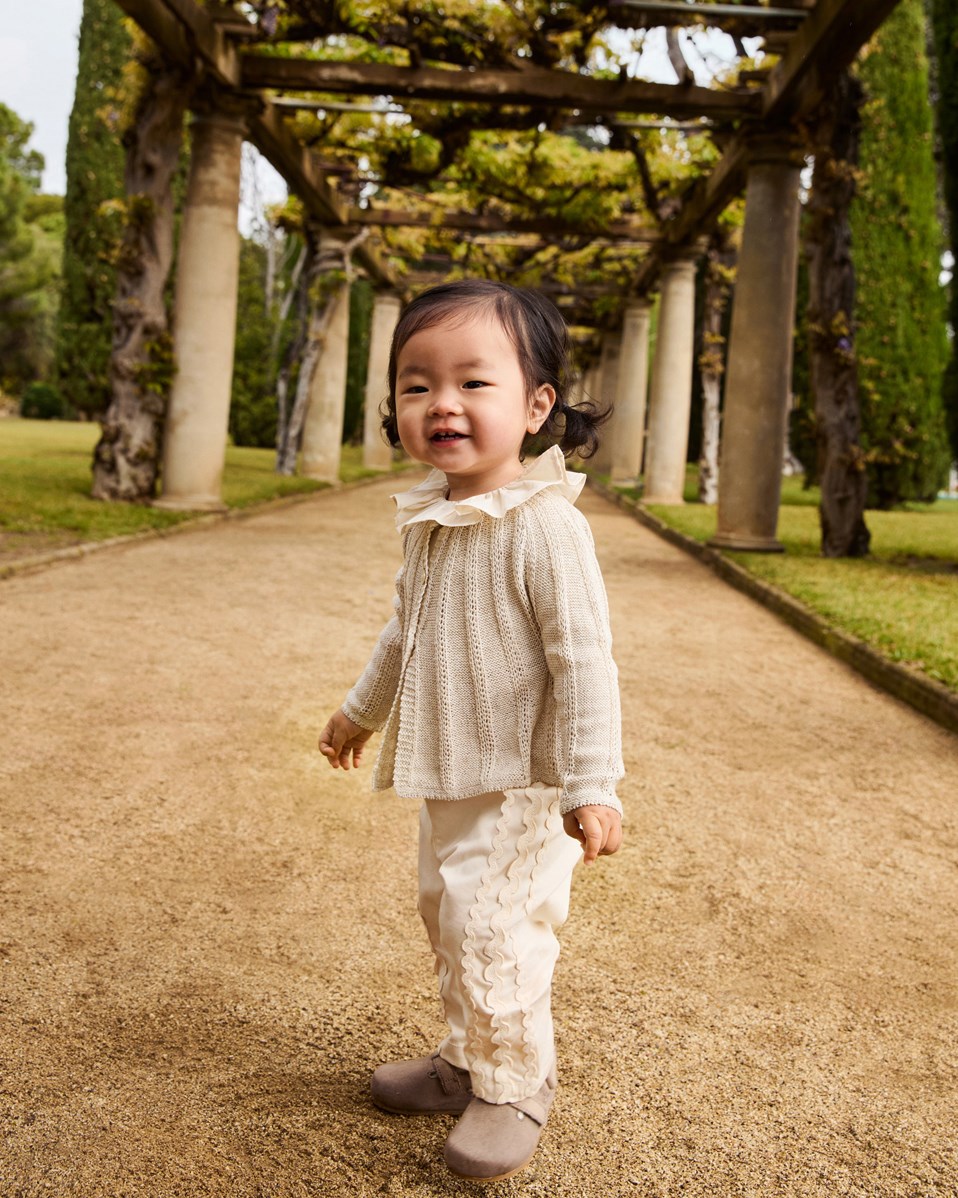 Sally - Brazilian Sand - Organic cotton summer pants for babies. Sand-coloured with delicate details.