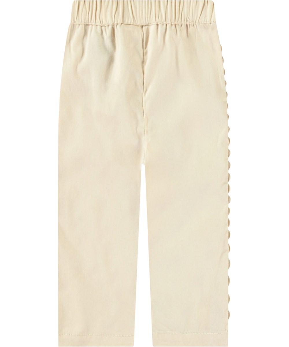 Sally - Brazilian Sand - Organic cotton summer pants for babies. Sand-coloured with delicate details.
