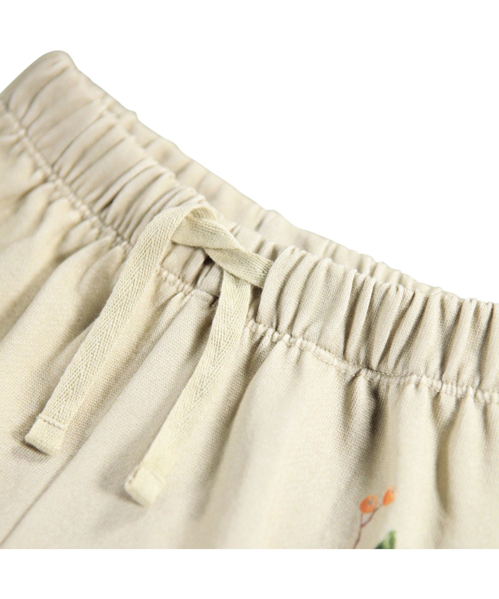 Simeon - Forest Squirrel - Soft light green pants for the little ones made of organic cotton with squirrels and flower print.