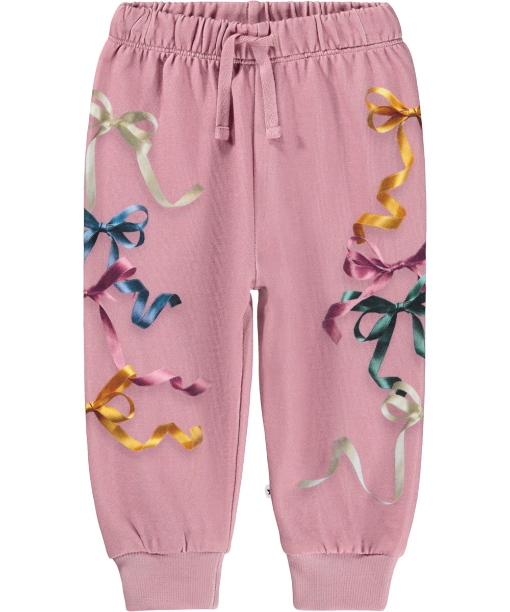 Simeon - Ribbon Play - Soft dark pink pants for the little ones made of organic cotton with a print of colorful ribbons and bows.