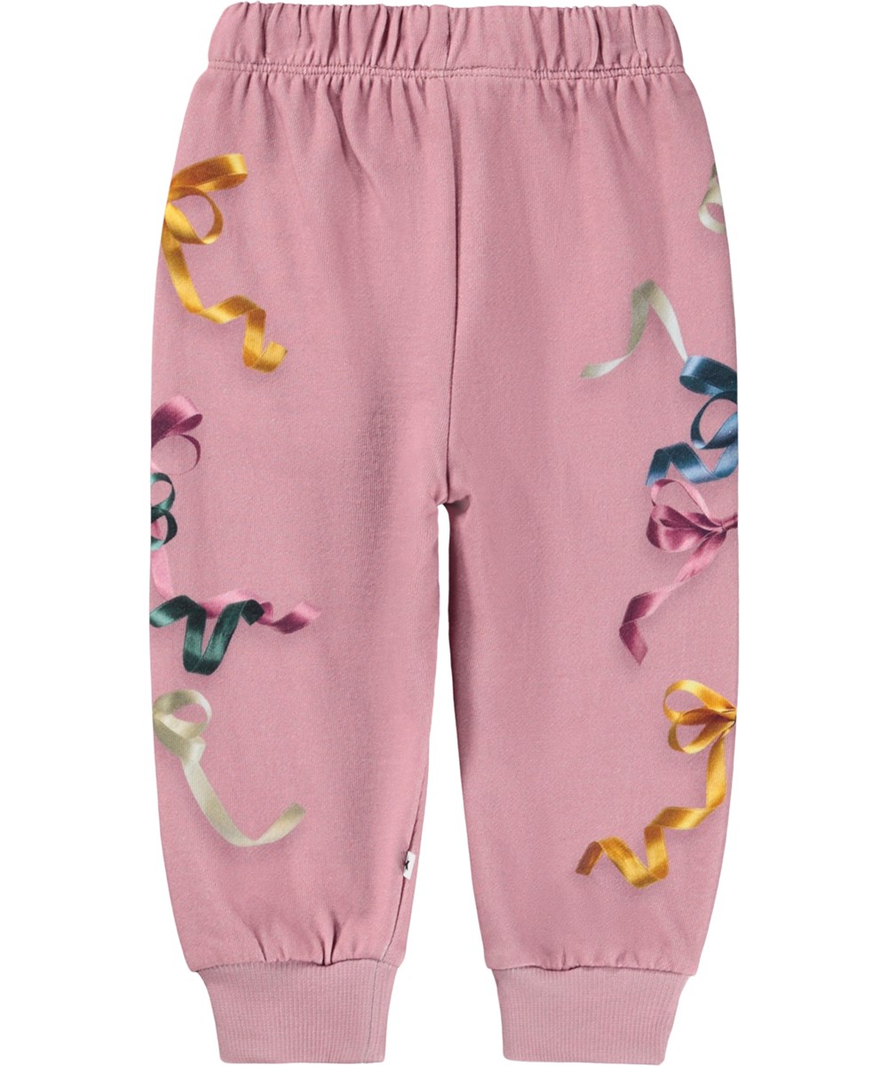 Simeon - Ribbon Play - Soft dark pink pants for the little ones made of organic cotton with a print of colorful ribbons and bows.