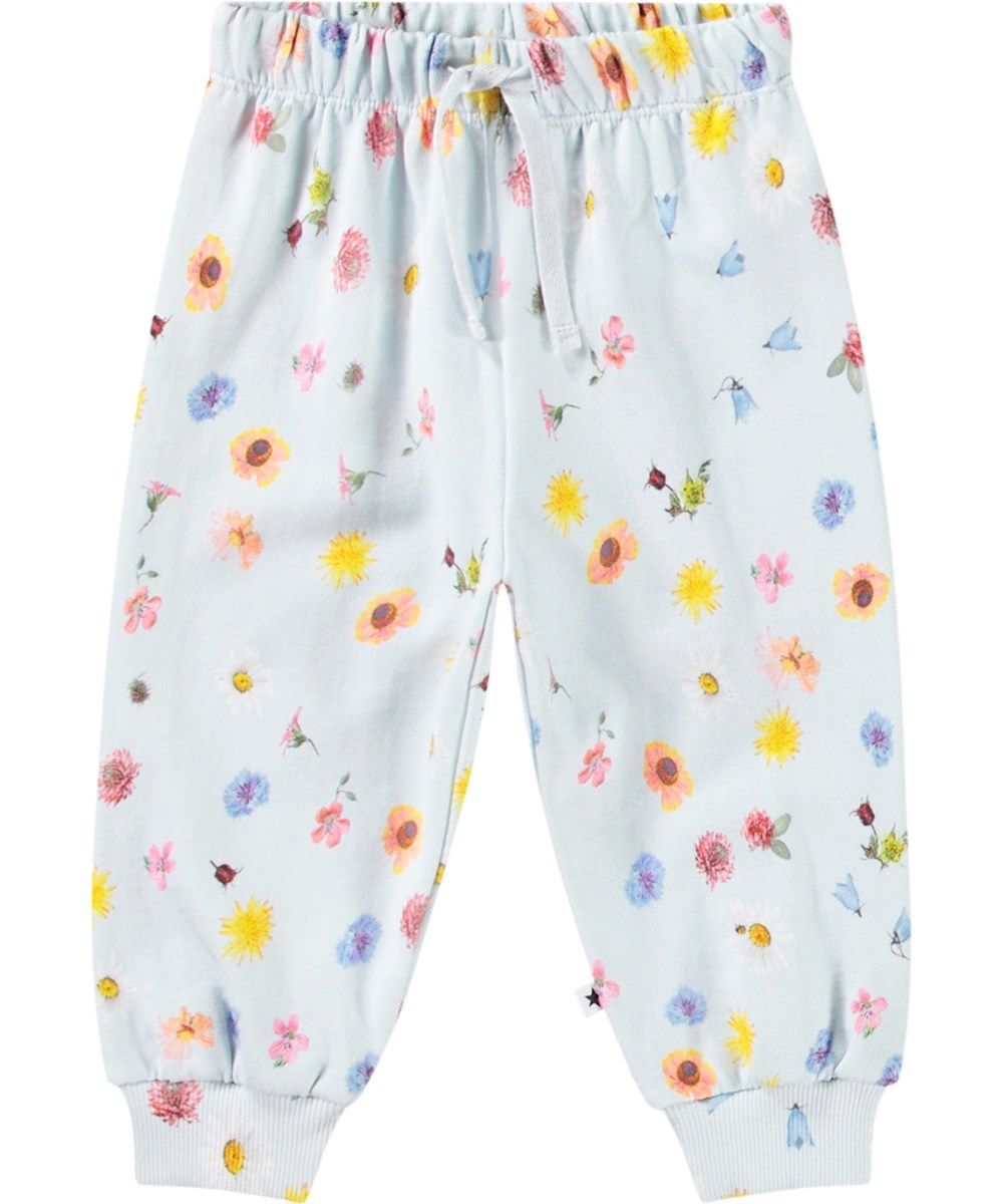 Simeon - Small Flowers Baby - Soft pants in organic cotton for baby. The trousers are light blue with a floral print.
