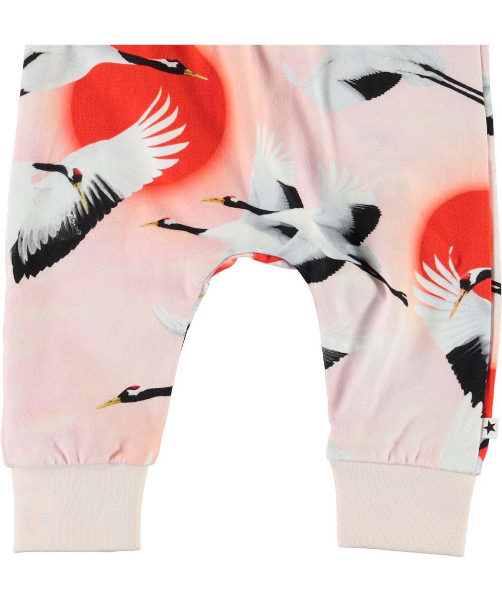 Simone - Sunrise Cranes - Pink baby trousers with birds