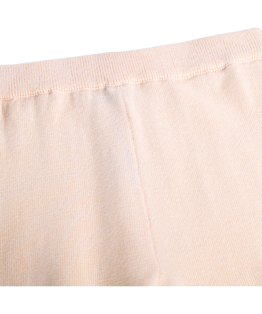 Sol - Folklore Garden - Pink knitted trousers for the little ones made of organic cotton with flowers 