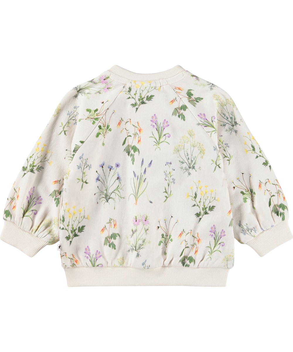 Daphne - Primavera - White cardigan for the little ones made of  organic cotton with a floral print and ruffles