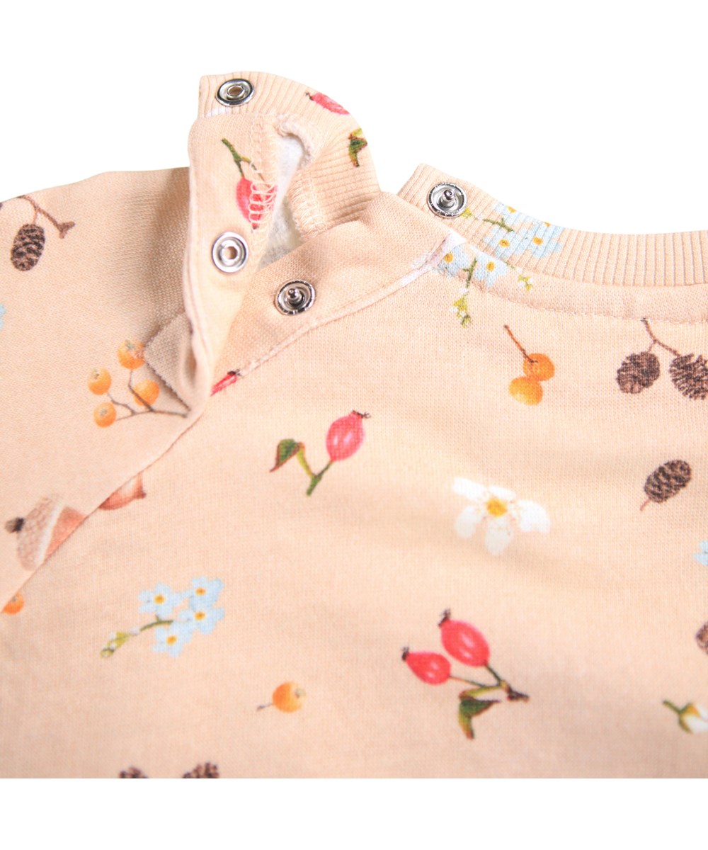 Disc - Foraging Rose - Organic rose baby sweatshirt with a print of nuts, flowers and berries.