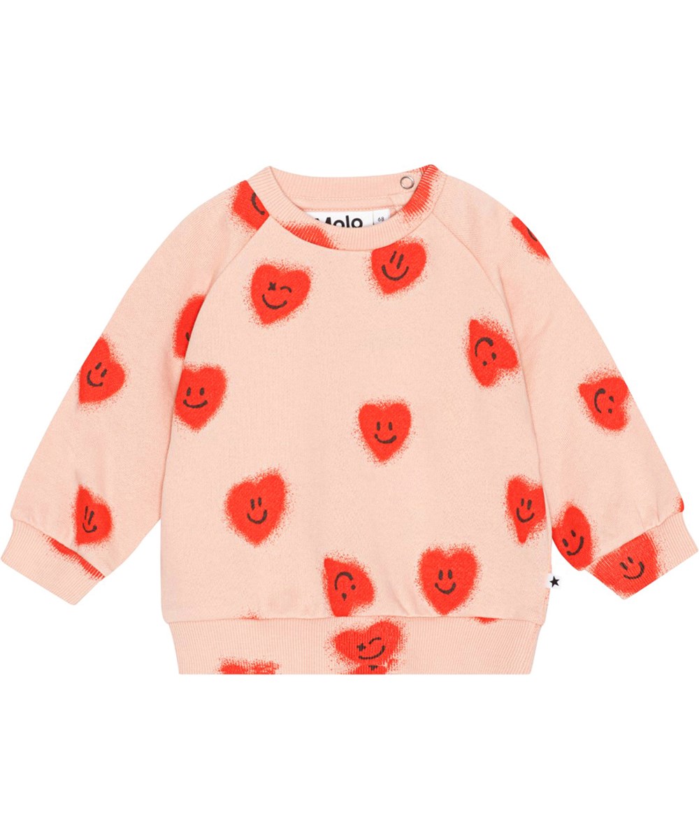 Disc - Red Hearts - Rose coloured jumper for small children in organic cotton jersey in all over print of red, smiling hearts 
