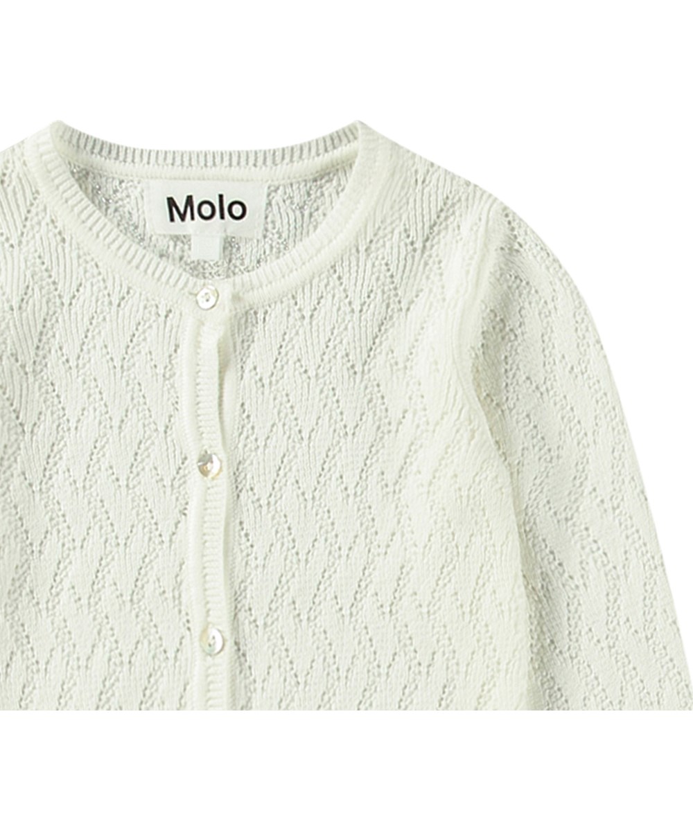 Gilli - Crisp White - White knitted baby cardigan with a delicate pattern.