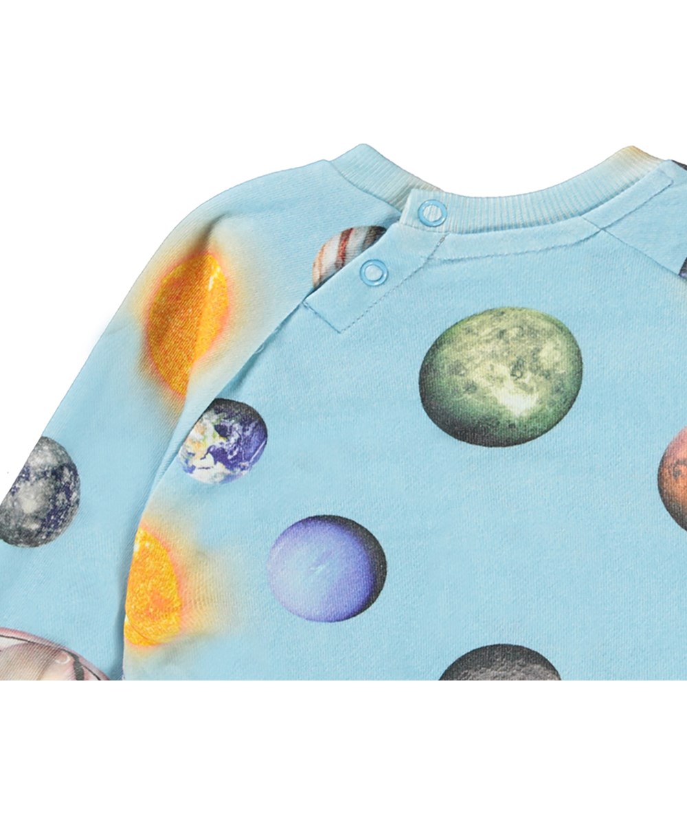 Disc - Planets - Lichtblauwe biologische babysweater met planeten