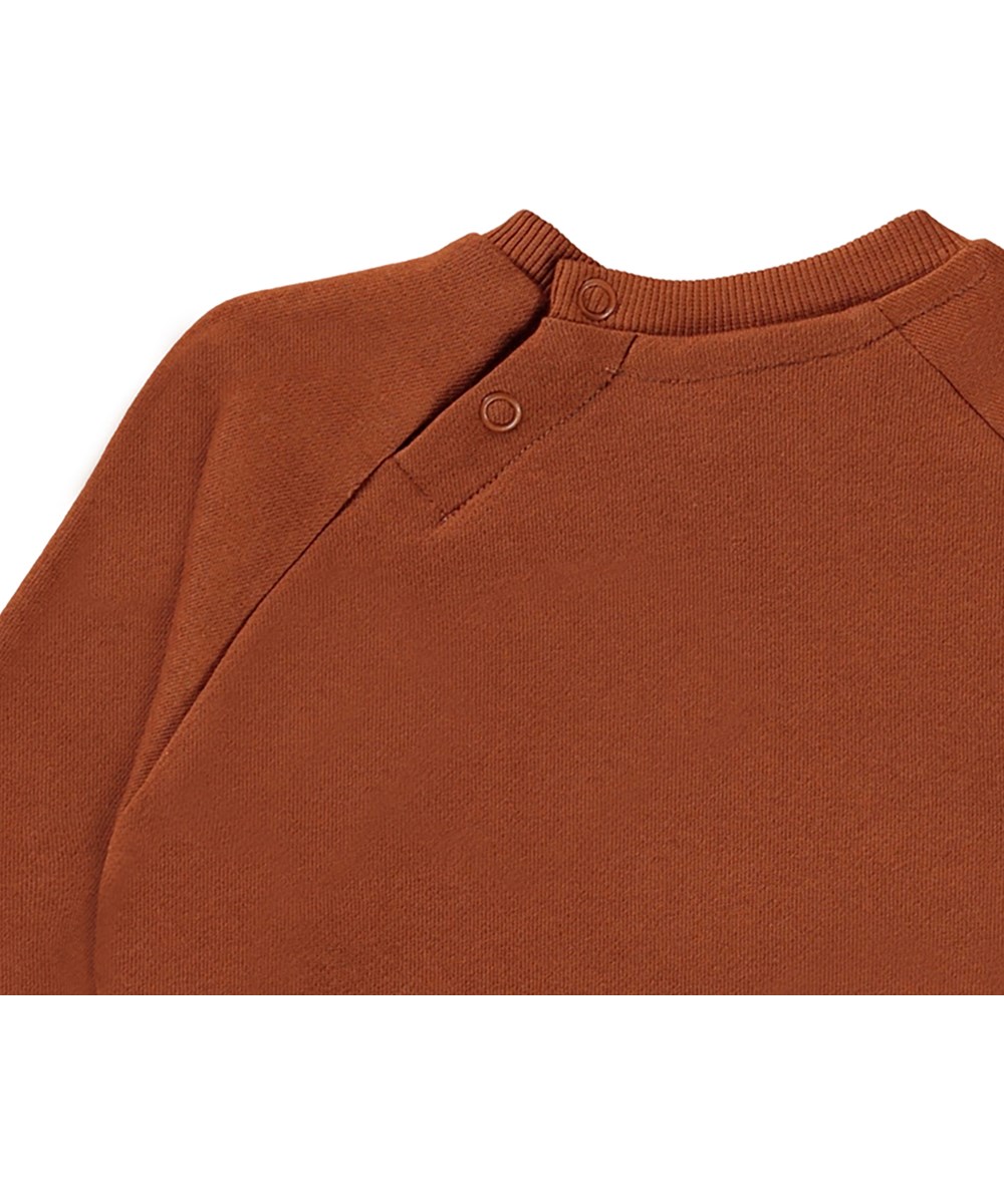 Disc - Spin Me Around - Bruine babysweater met de Aarde en de maan