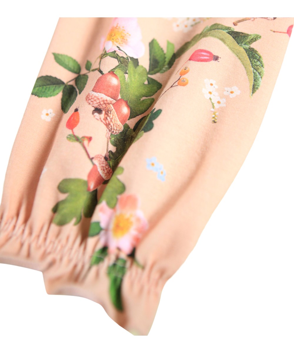 Selena - Forest Vine - Hosen für die Kleinen aus Öko-Baumwolle mit einem Druck von Zweigen und Blumen.