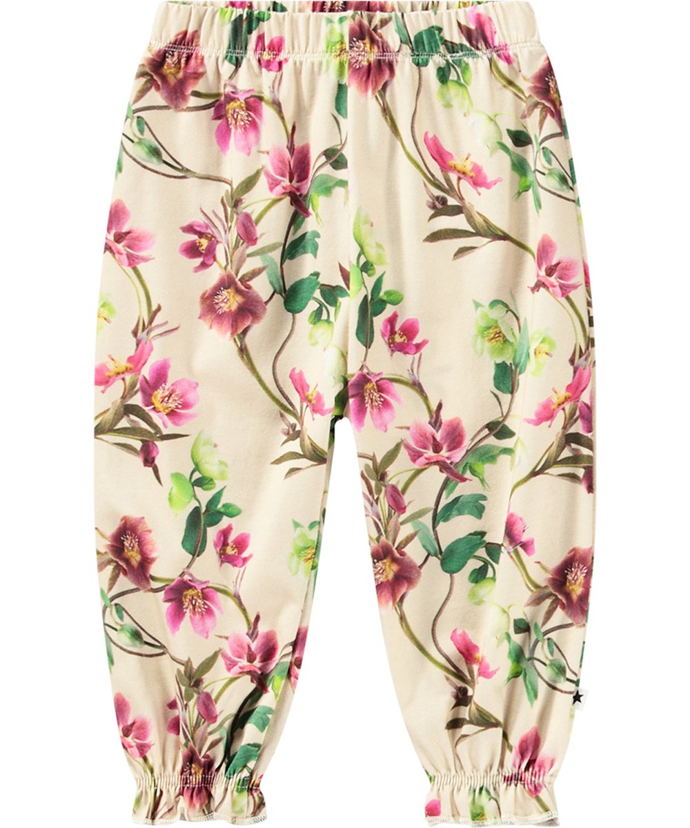 Selena - Hellebore - Off-weiße Jerseyhose aus Öko-Baumwolle mit Blumendruck.