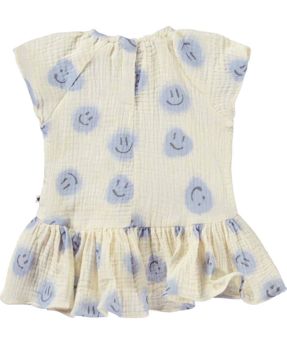 Carolina - Crisp Smiles - Weißes Babykleid mit blauem Aufdruck mit lächelndem Gesicht