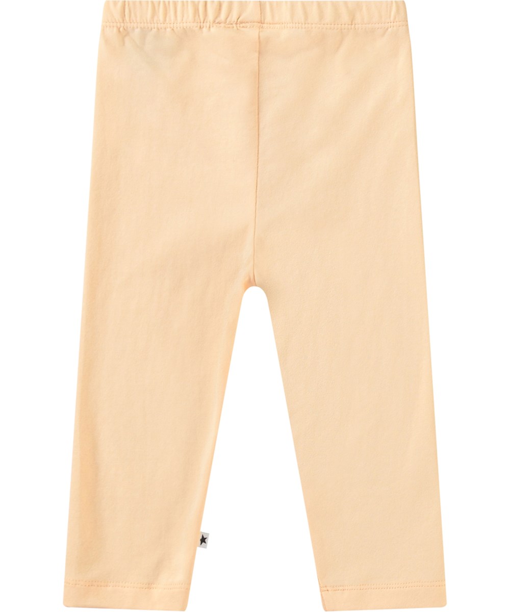 Nette Solid - Pale Melon - Helle orangefarbene Baby-Leggings aus Öko-Baumwolle.