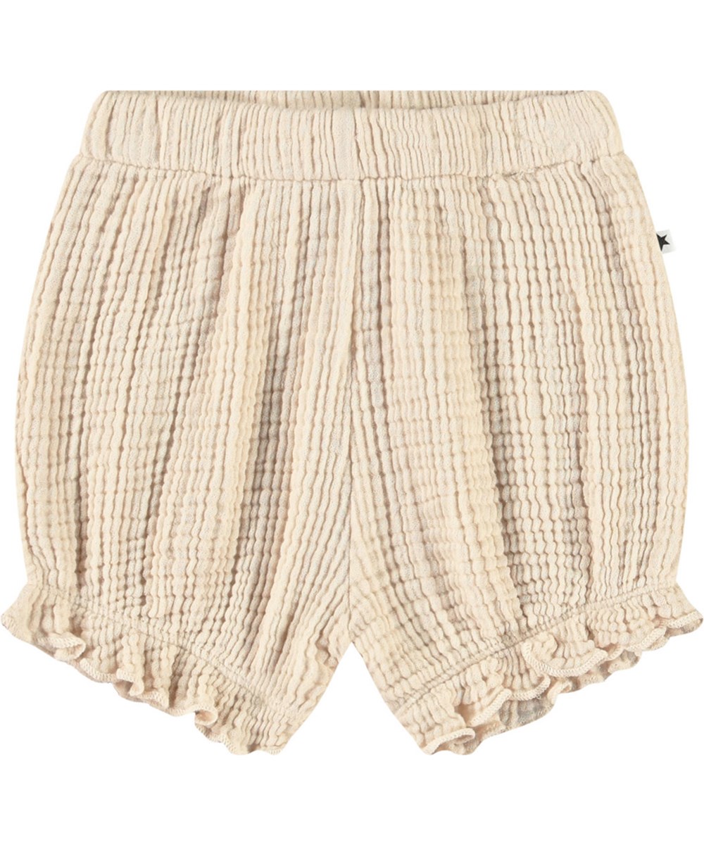 Safira - Brazilian Sand - Sandfarbene Bloomer-Shorts aus gekräuselter Öko-Baumwolle für Babys.