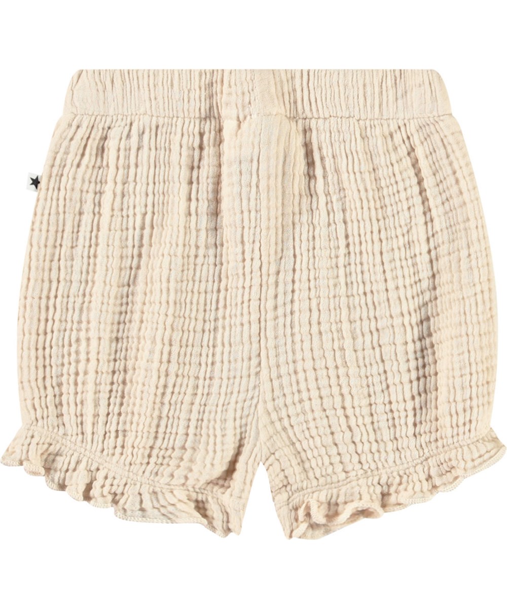 Safira - Brazilian Sand - Sandfarbene Bloomer-Shorts aus gekräuselter Öko-Baumwolle für Babys.