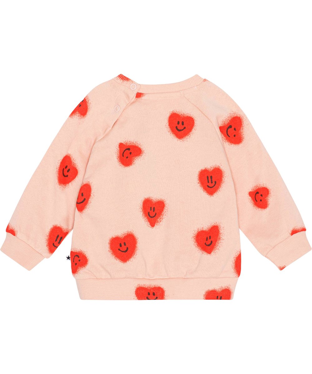 Disc - Red Hearts - Rosafarbener Pullover für die Kleinen aus Öko-Baumwolljersey mit Allover-Print aus roten, lächelnden Herzen.