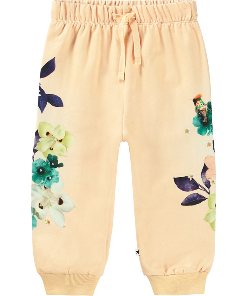Simeon - Lovely Floral - Lichtgele biologische katoenen joggingbroek met elastische tailleband, geribbelde boorden en bloemenprint.