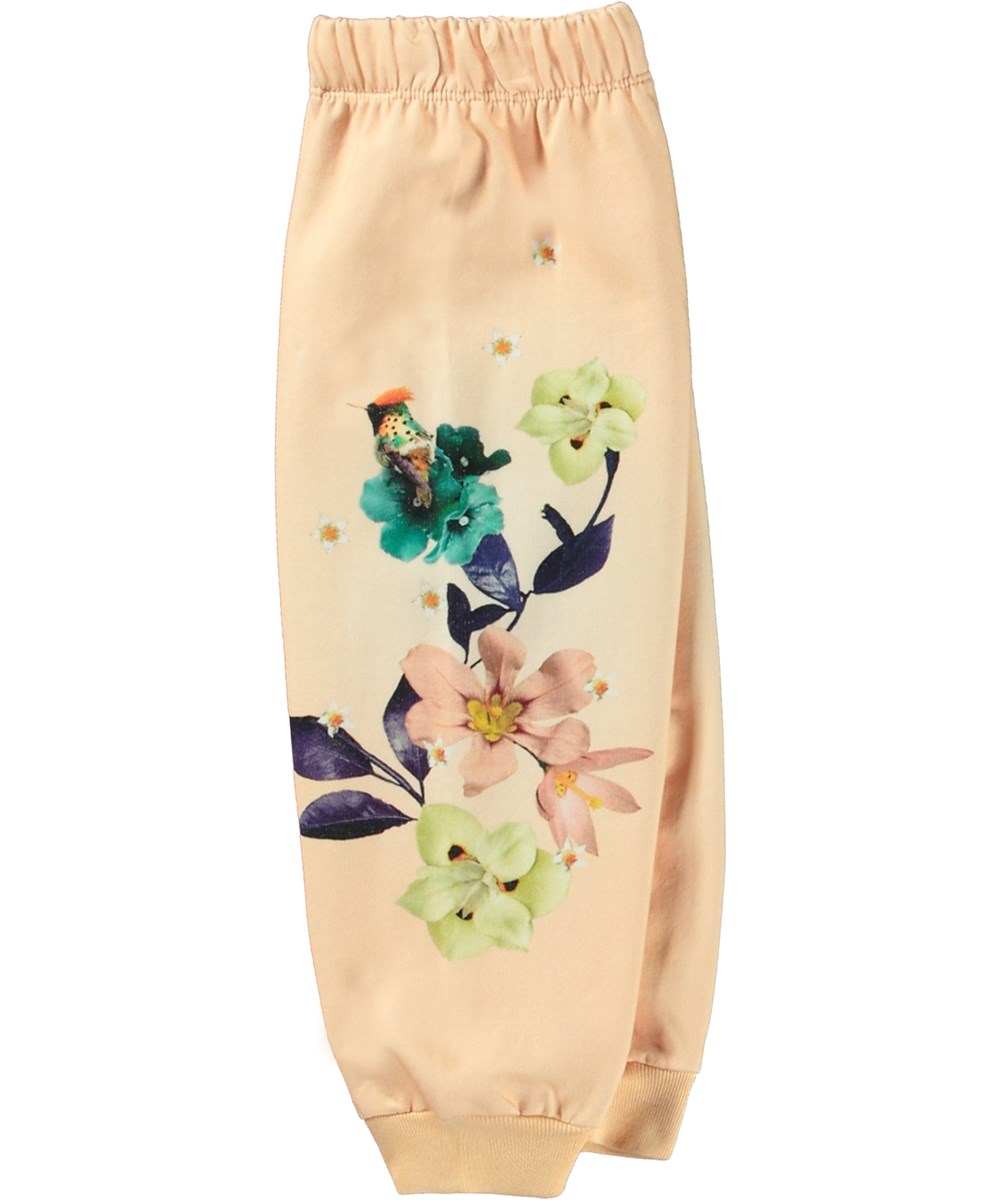 Simeon - Lovely Floral - Lichtgele biologische katoenen joggingbroek met elastische tailleband, geribbelde boorden en bloemenprint.