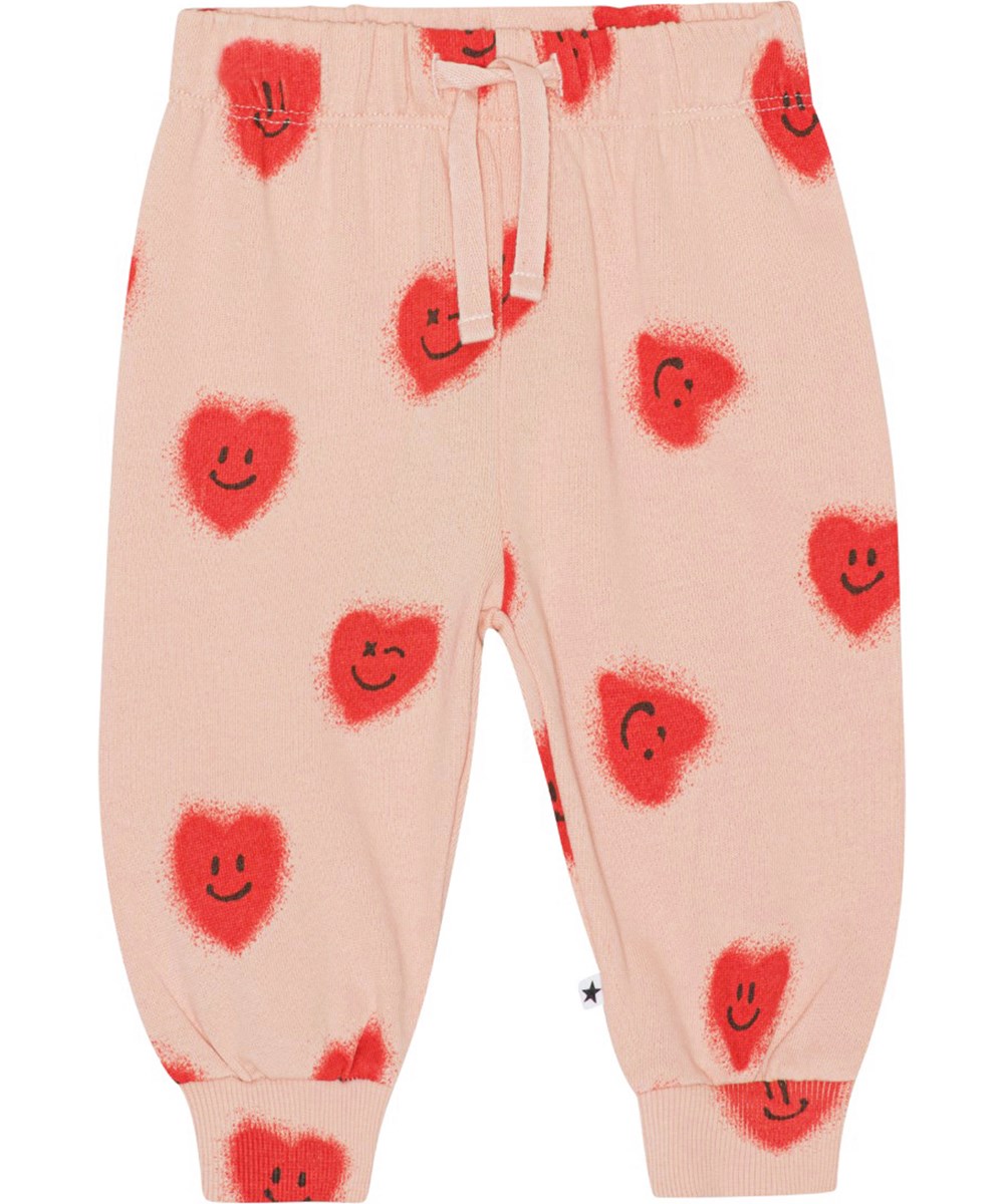 Simeon - Red Hearts - Voor kleine kinderen een roze joggingbroek van biologisch katoen met een print van rode lachende hartjes