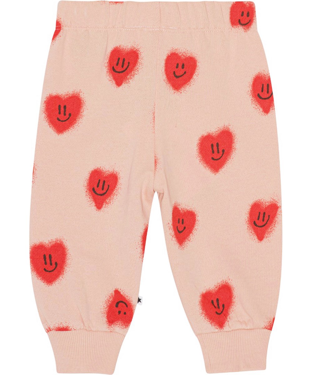 Simeon - Red Hearts - Voor kleine kinderen een roze joggingbroek van biologisch katoen met een print van rode lachende hartjes
