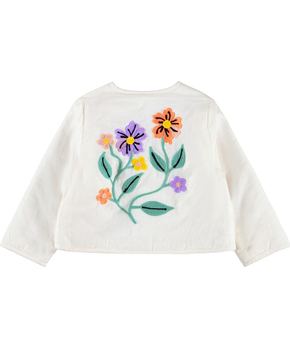 Happy - Meadow Flowers - Wit jasje voor de kleintjes gemaakt van katoen met een borduursel.