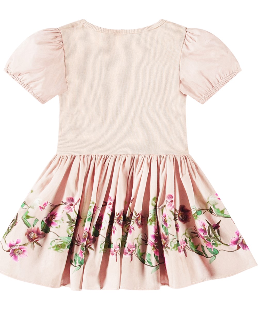 Caitlin - Mini Hellebore - Lichtroze biologisch katoenen jurk voor baby's en peuters met geribbelde top en poplin rok met bloemenprint.