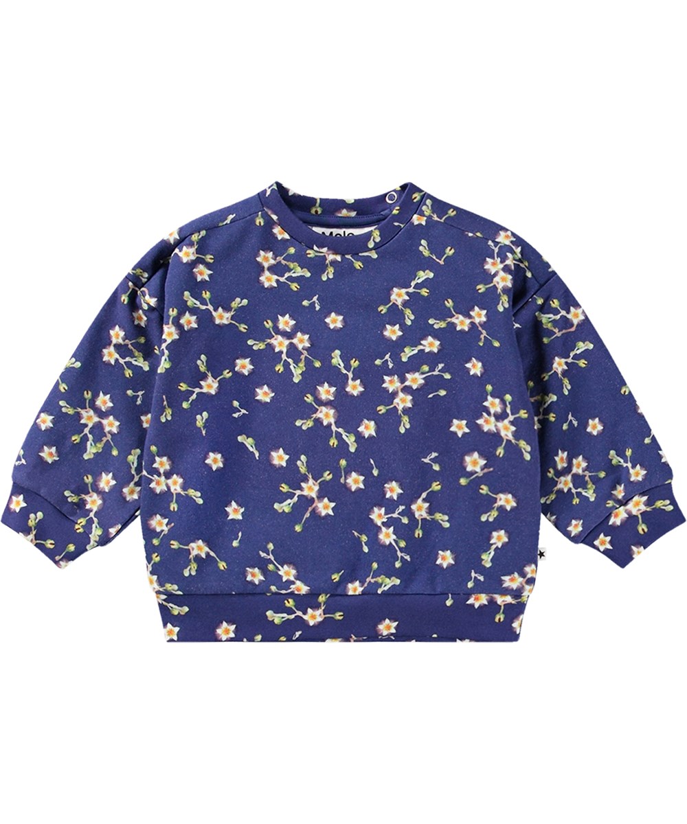 Dana - Sky Flowers - Donkerblauwe biologische katoenen sweater met een all-over witte bloemenprint.