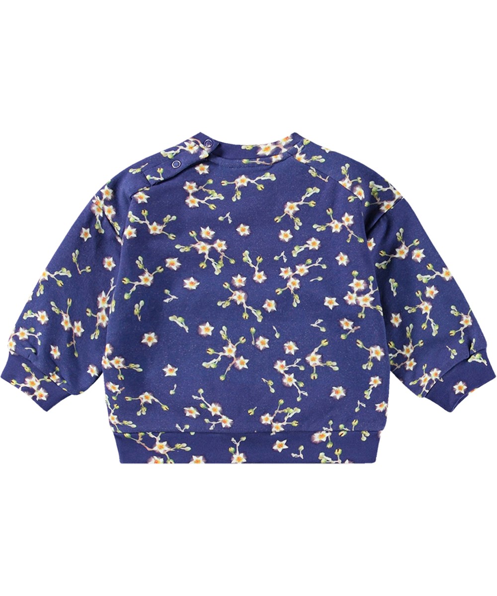 Dana - Sky Flowers - Donkerblauwe biologische katoenen sweater met een all-over witte bloemenprint.