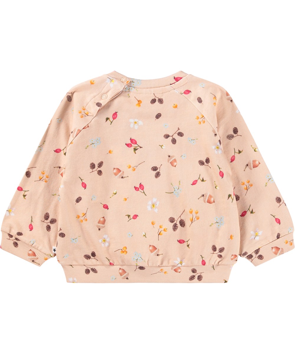Disc - Foraging Rose - Biologische roze baby sweater met een print van noten, bloemen en bessen.
