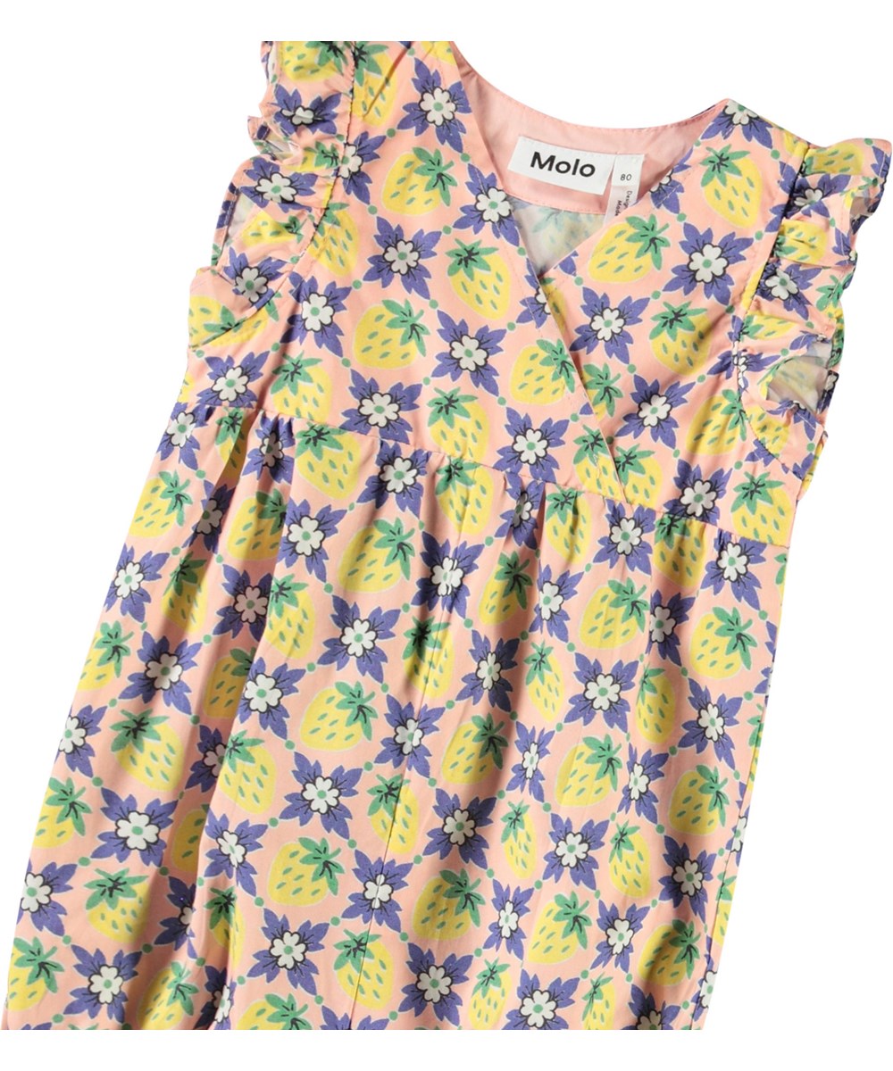 Fonda - Vintage Berries - Heldragt i blødt økologisk bomuldsjersey til baby. Dragten har print af lilla blomster og gule jordbær. 