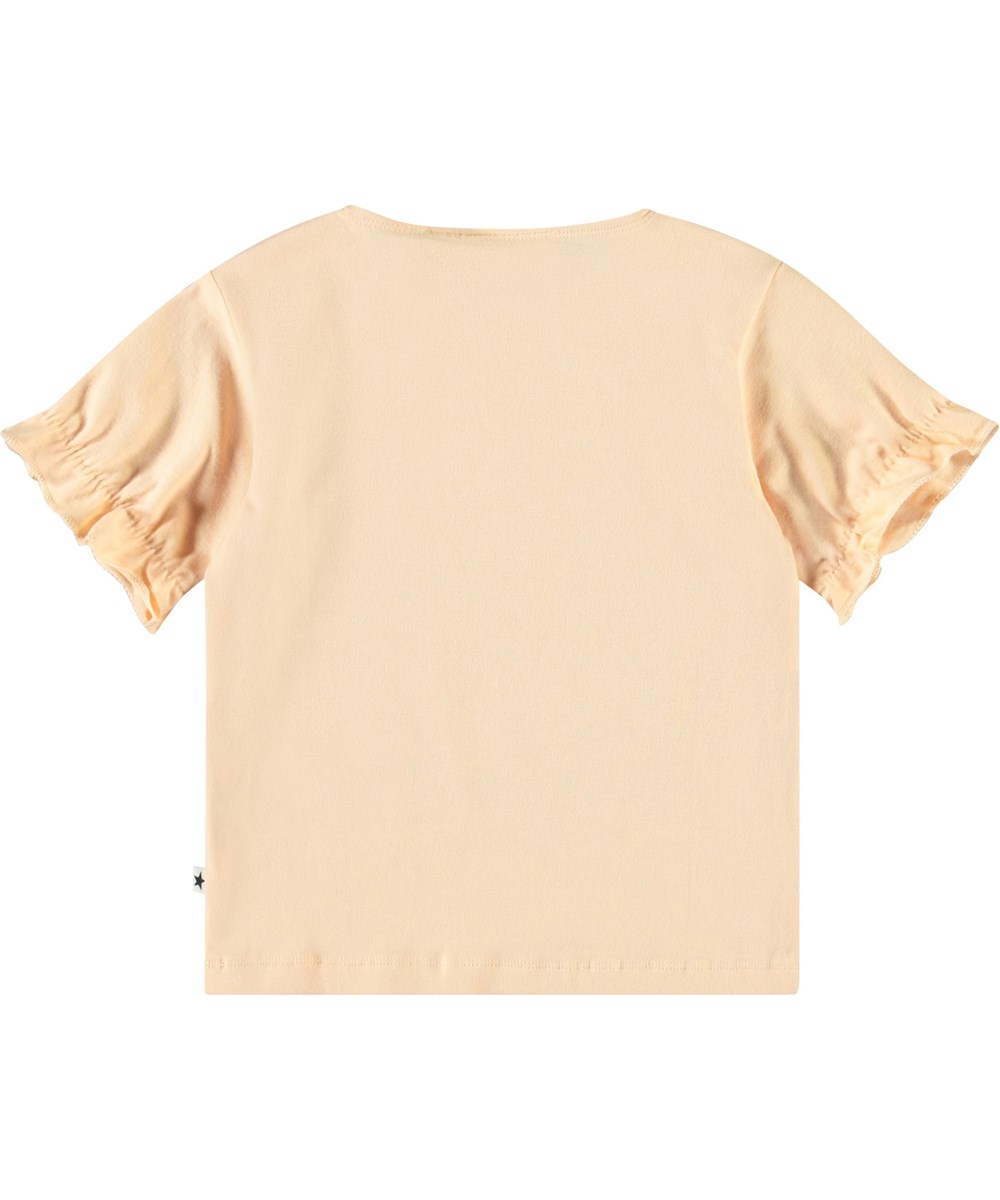 Eline - Cubs Friends - T-shirt med flæsedetaljer i økologisk bomuld til baby. T-shirten er ferskenfarvet med print af dyreunger i blomsterbed.