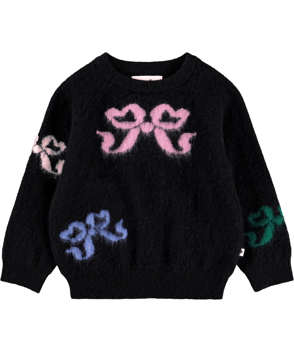 Gilby - Fancy Bows - Striktrøje i uld til baby. Trøjen er sort med multifarvede vævede sløjfer på front og bag.