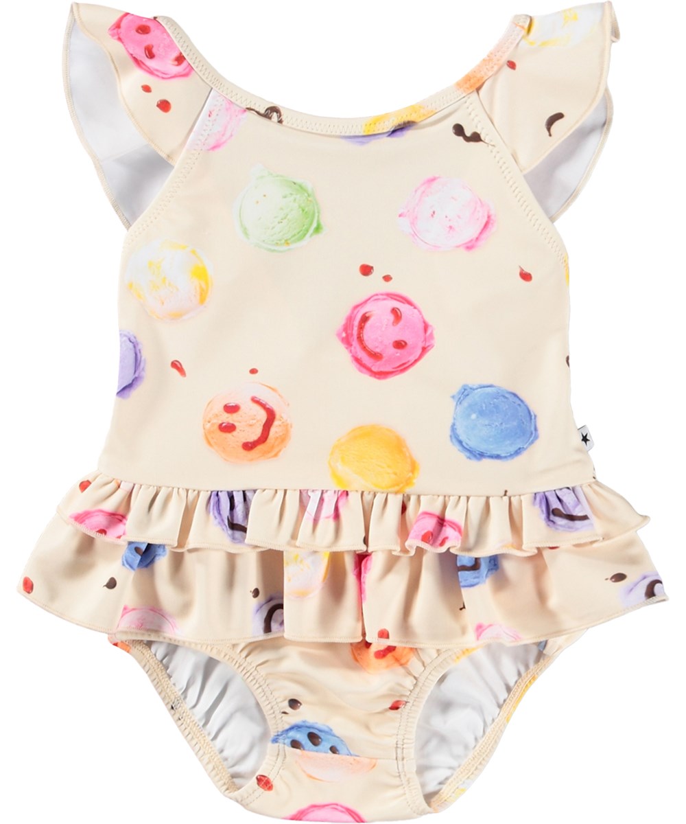 Nalani - Smile Scoops - Cremefarbener Baby-Badeanzug mit Eiscreme-Print aus recyceltem Polyester mit UV-Schutz 50+.