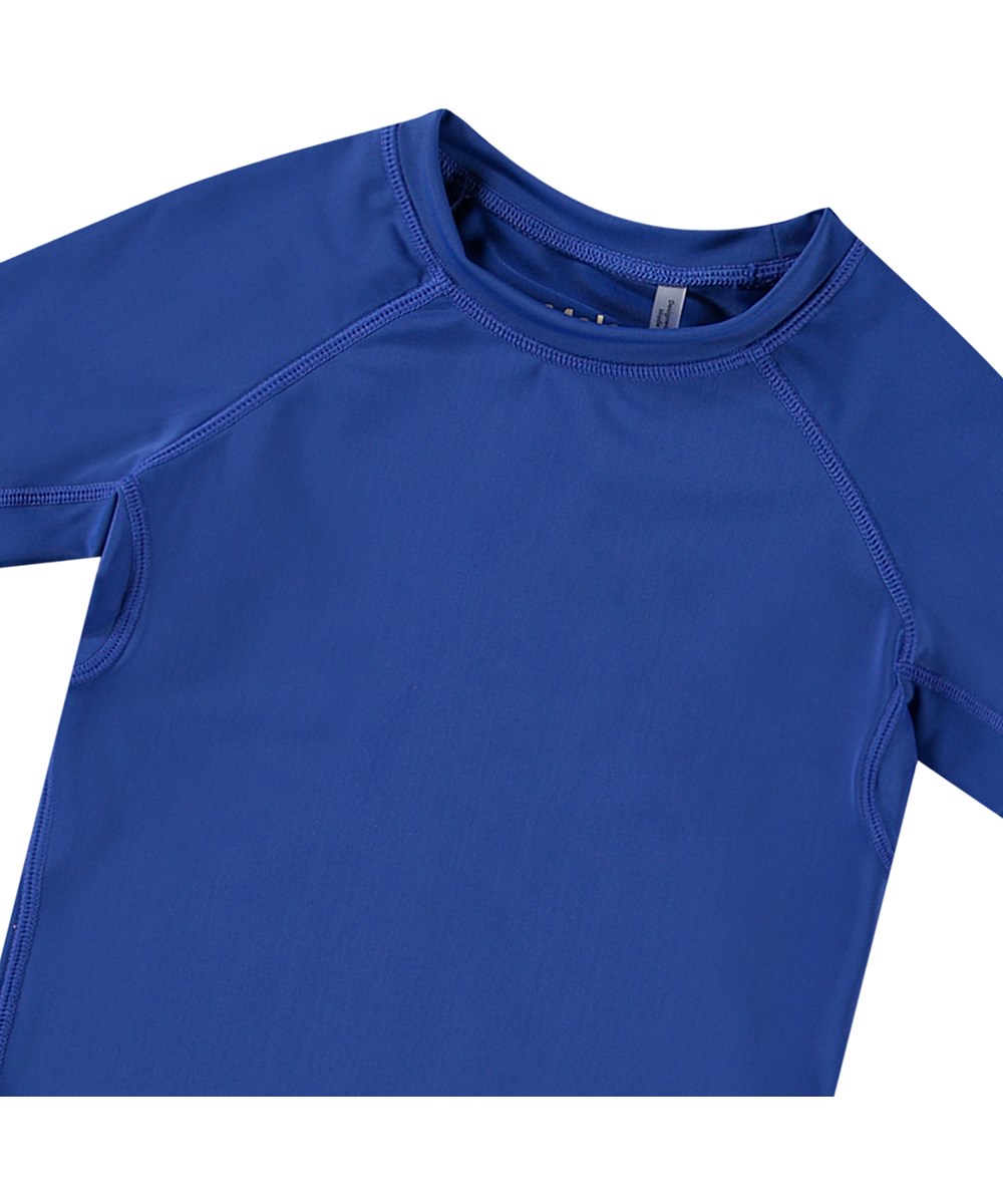 Neptune - Reef Blue - Blauer Kurzarm-Rashguard für aktive Kinder aus recyceltem Polyester mit UV-Schutz 50+.