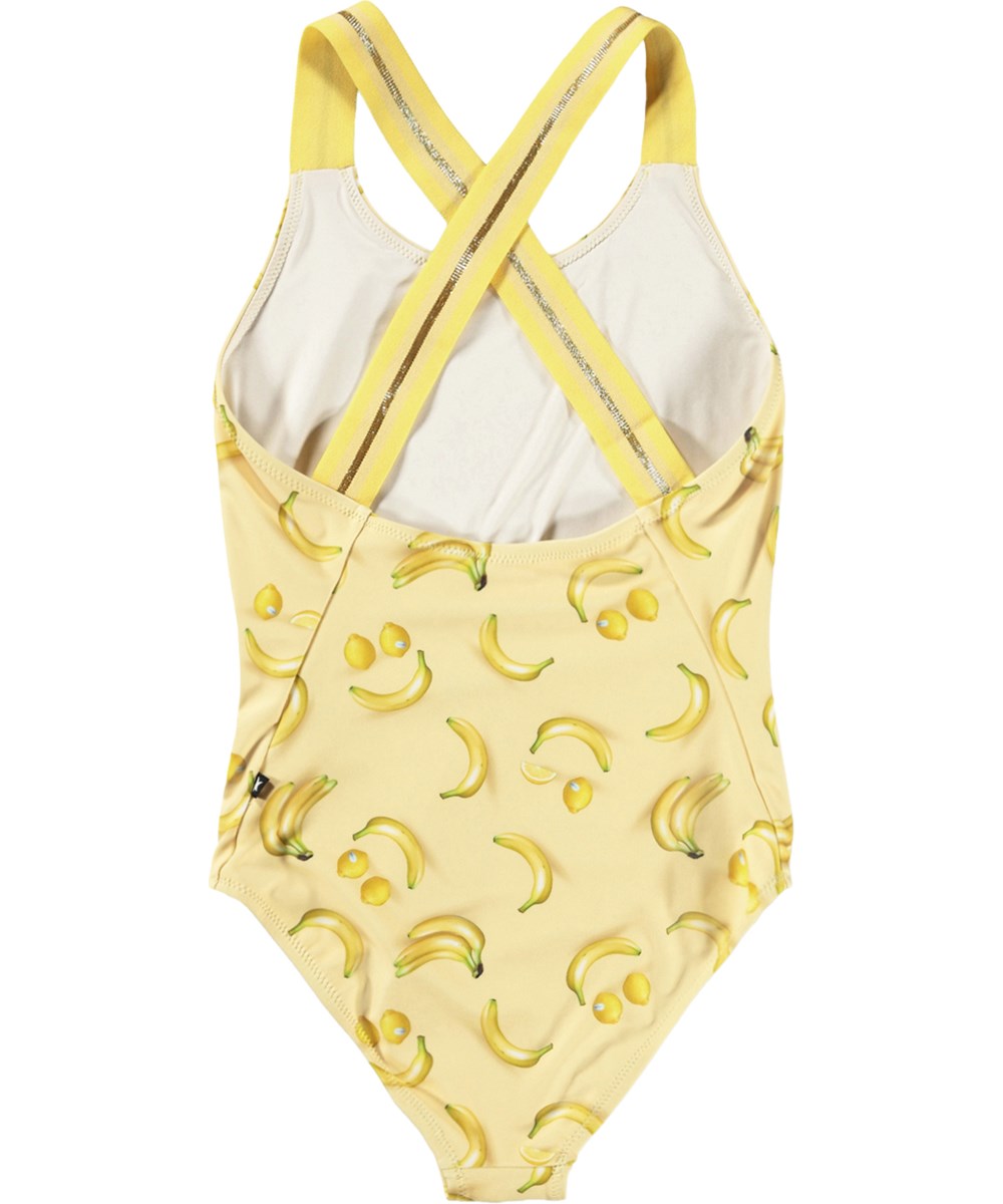 Neve - Lemon Banana - Gelber Badeanzug mit Bananenmuster für Kinder aus recyceltem Polyester und UV-Schutz 50+.
