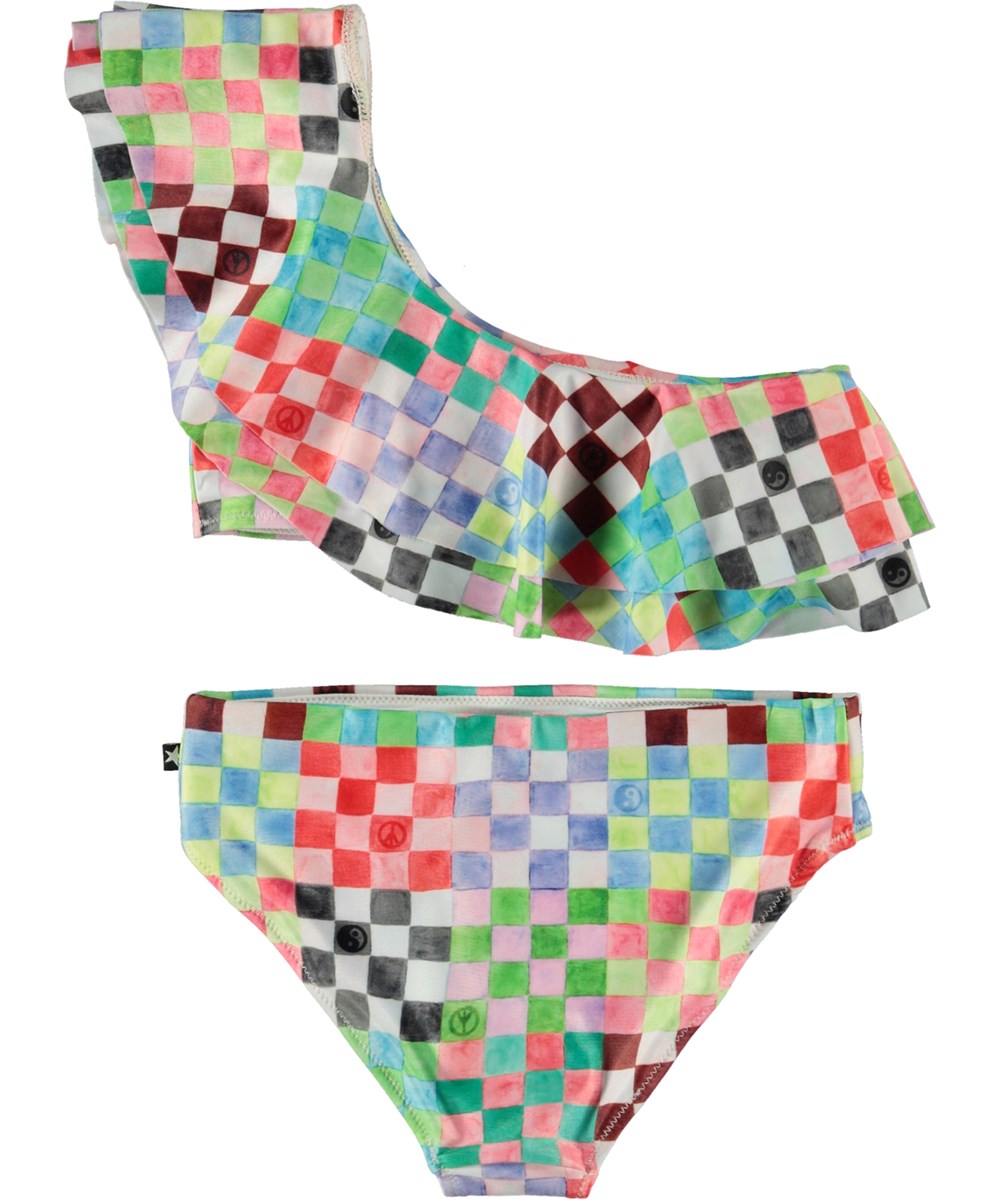 Nikkie - Check Petit - Hellblauer asymmetrischer Bikini mit Rüschen und buntem Karomuster