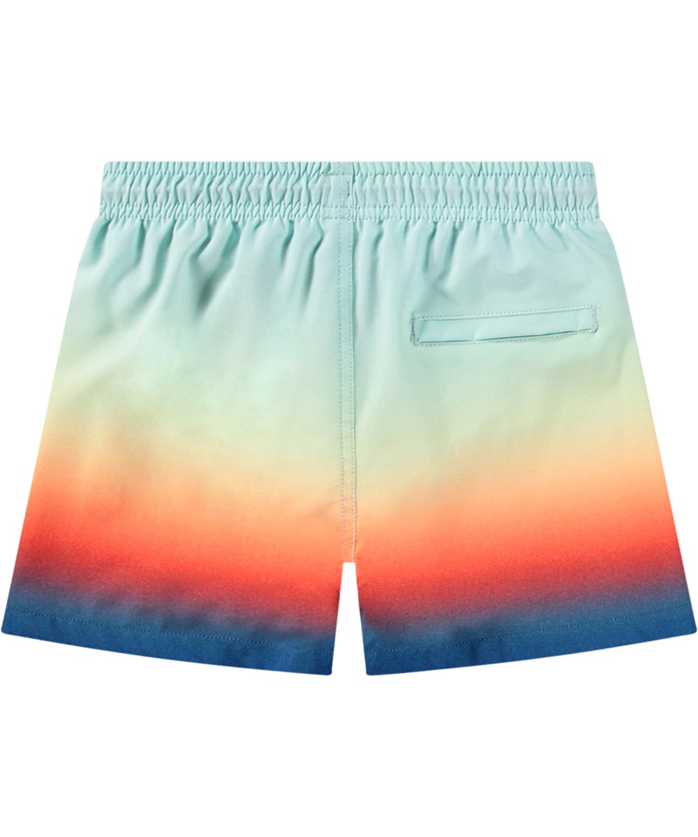 Niko - Blue Fade - Bunt gestreifte sportliche Badehosen für aktive Kinder aus recyceltem Polyester mit UV-Schutz 50+.