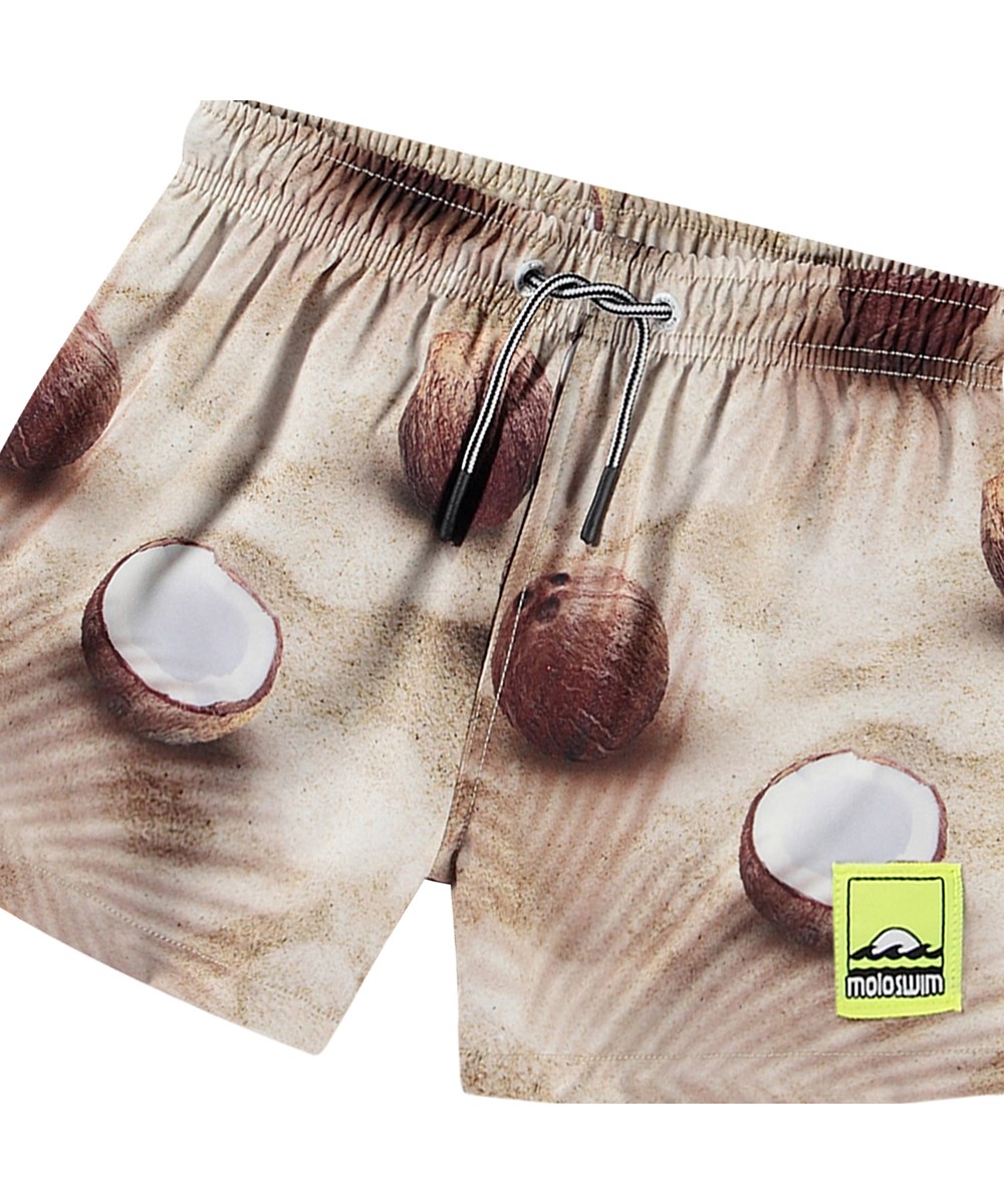 Niko - Coconuts - Beige sportliche Badehosen für aktive Kinder aus recyceltem Polyester mit UV-Schutz 50+.