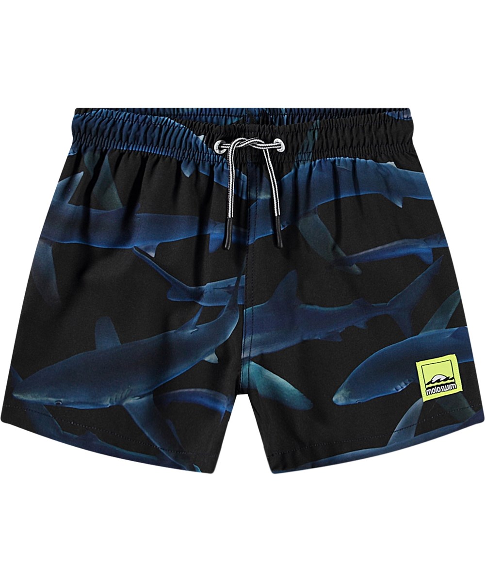 Niko - Midnight Sharks - Schwarze sportliche Badehosen für aktive Kinder aus recyceltem Polyester mit UV-Schutz 50+.