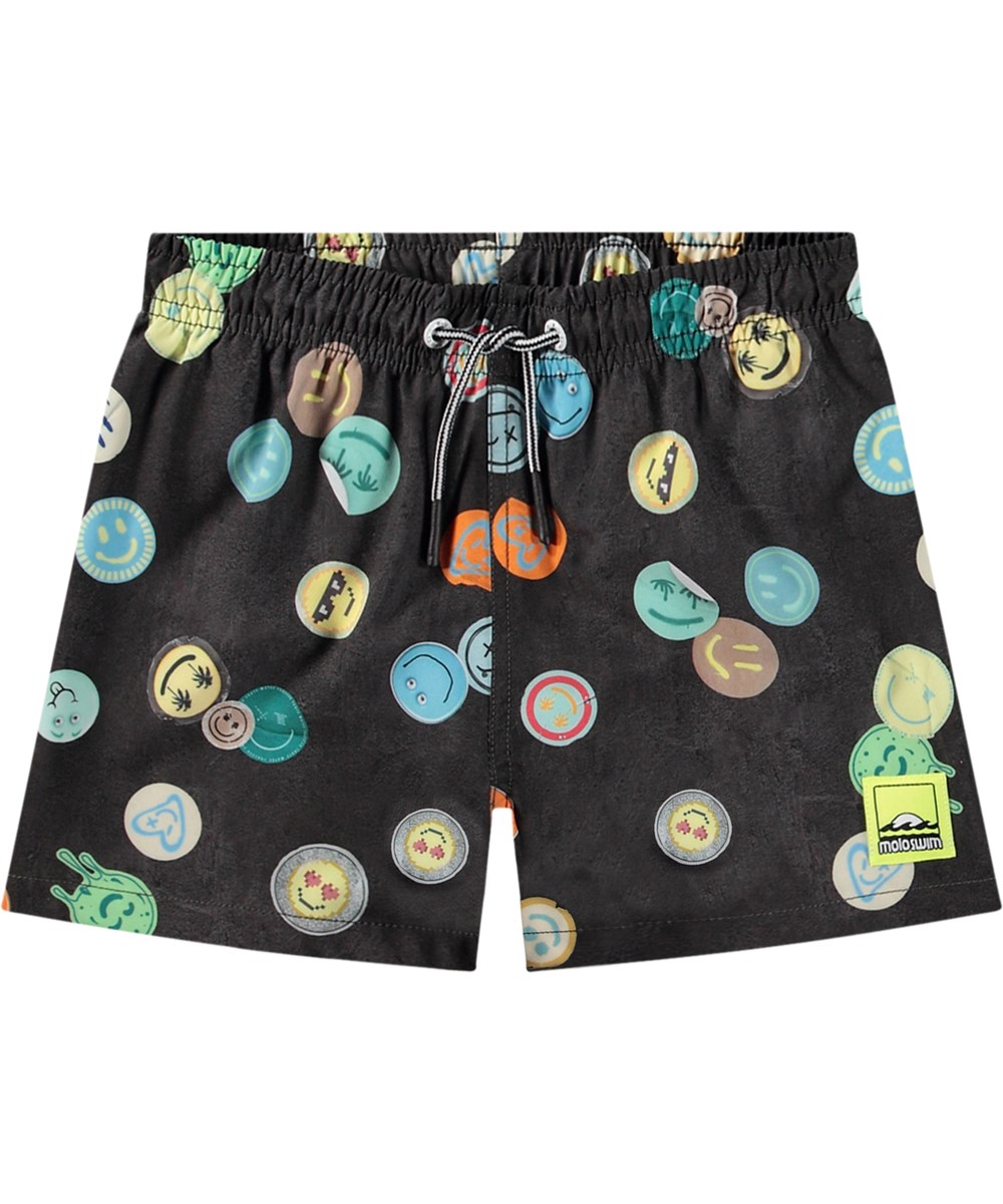 Niko - Smile All Over - Schwarze sportliche Badehosen für aktive Kinder aus recyceltem Polyester mit UV-Schutz 50+.