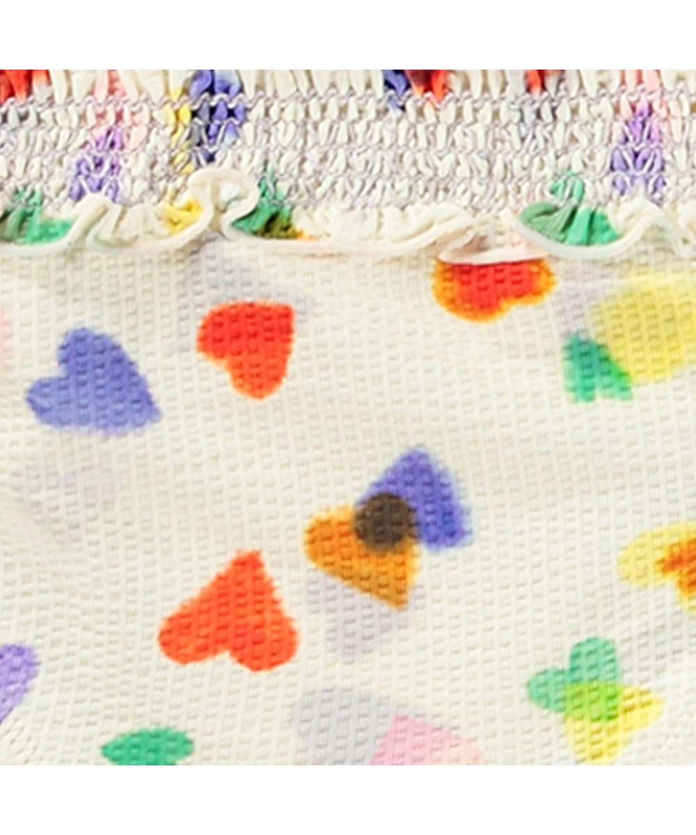 Nita - Rainbow Hearts - Dehnbarer Bikini in Weiß mit bunten Herzen für aktive Kinder mit UV-Schutz 50+