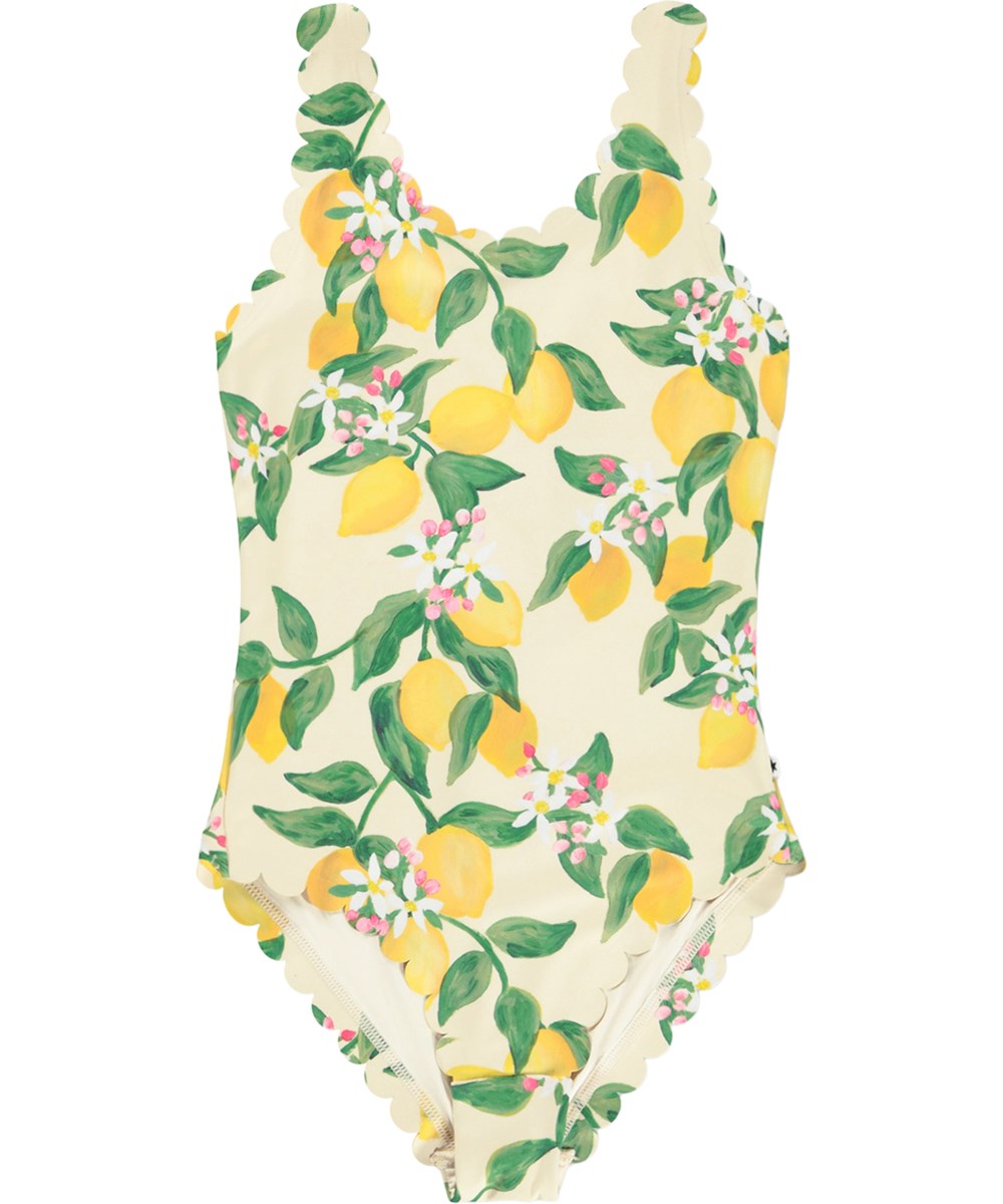 Noelle - Citrus - Gelber Badeanzug mit Wellenkanten und Zitrusdruck für Kinder aus recyceltem Polyester mit UV-Schutz 50+.