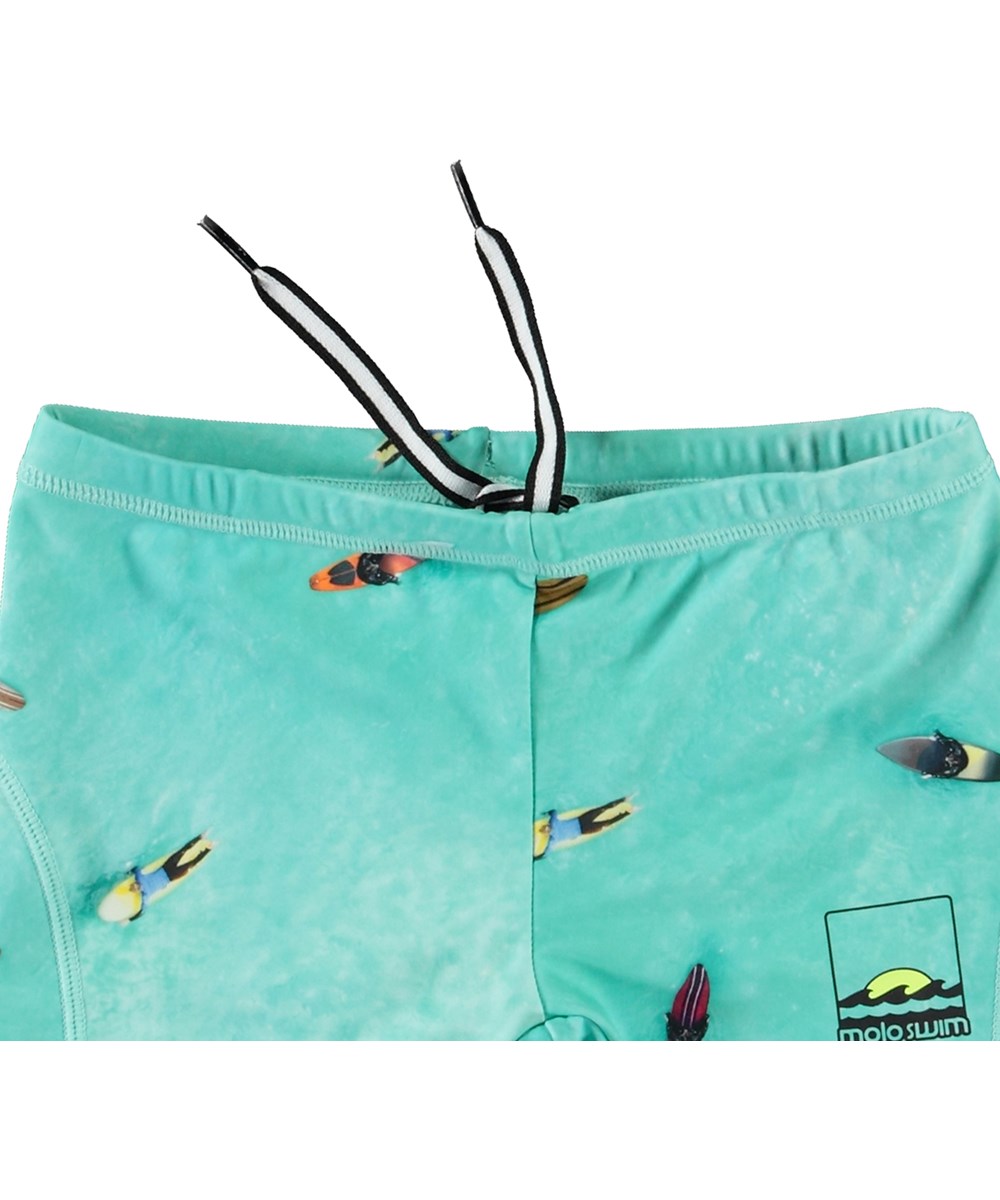 Norton - Ocean Surfers - Türkisblaue sportliche Badehosen für Kinder aus recyceltem Polyester mit UV-Schutz 50+.