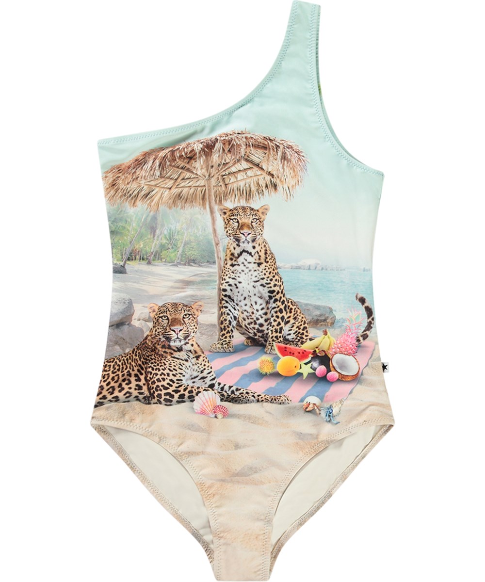 Nai - On The Beach - Lyseblå one-shoulder badedragt til aktive børn i genanvendt polyester og UV-beskyttelse 50+.