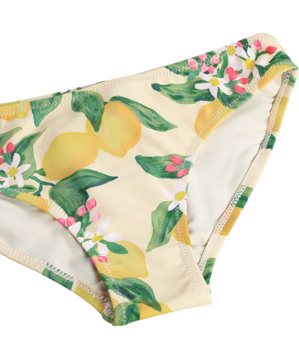 Naja - Citrus - Gul, asymmetrisk bikini med citrusprint til børn i genanvendt polyester med UV-beskyttelse 50+.
