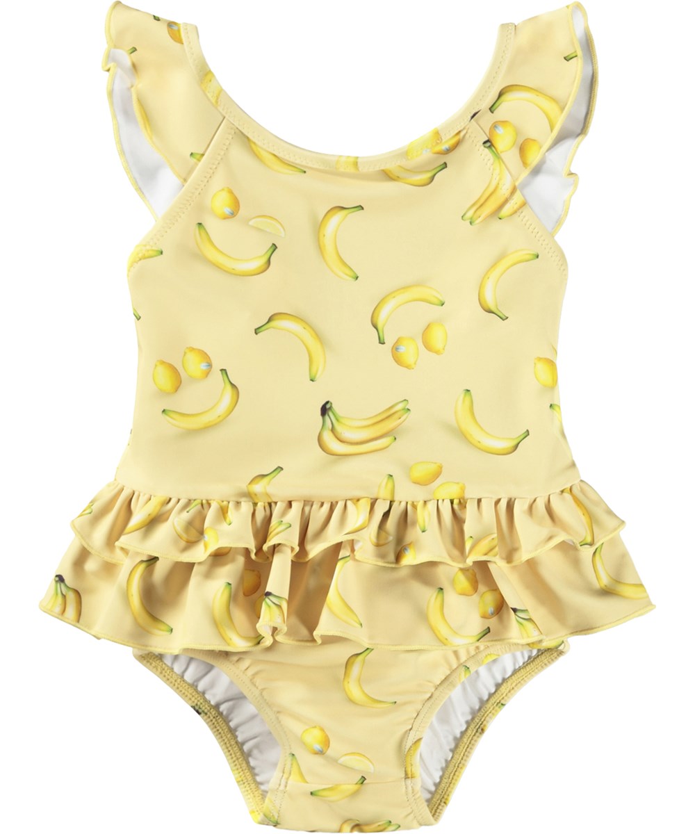 Nalani - Lemon Banana - Gul babybadedragt med frugtprint i genanvendt polyester med UV-beskyttelse 50+.