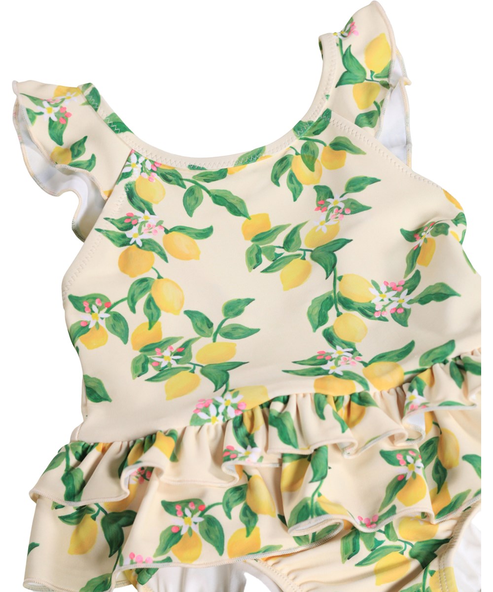 Nalani - Mini Citrus - Gul babybadedragt med citrusprint i genanvendt polyester med UV-beskyttelse 50+.