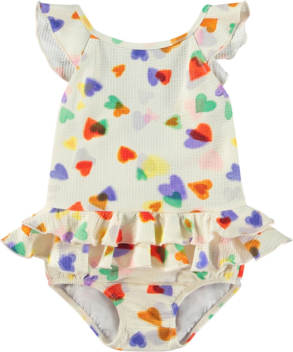 Nalani - Rainbow Hearts - Hvid baby badedragt i genanvendt polyester og UV-beskyttelse 50+.