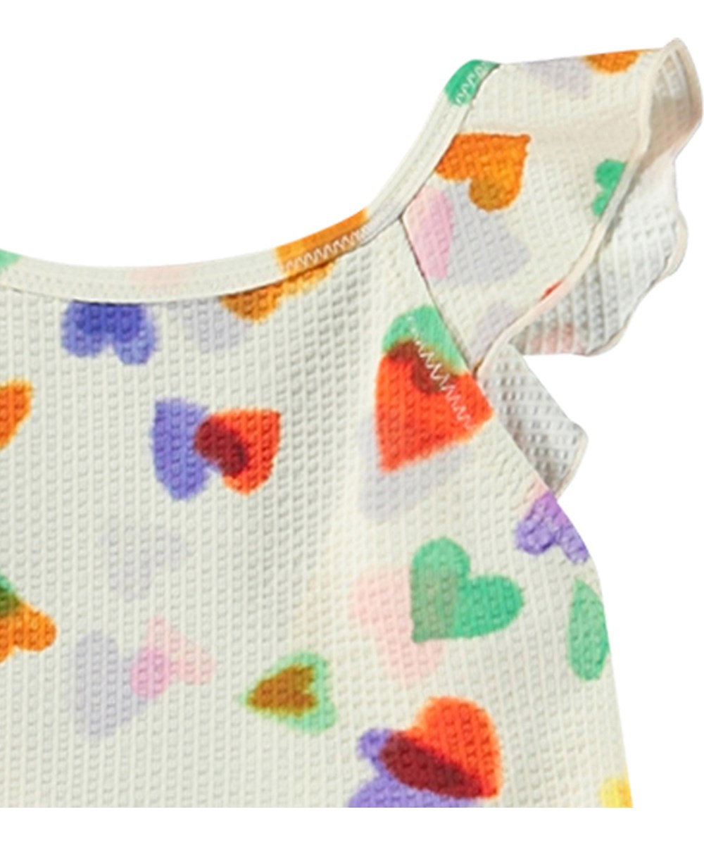 Nalani - Rainbow Hearts - Hvid baby badedragt i genanvendt polyester og UV-beskyttelse 50+.